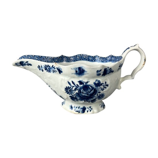 A mid 18thc Bow moulded sauceboat painted in underglaze blue c1765-70