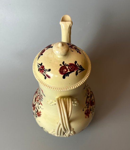 A late 18thc floral painted creamware coffee pot. Perhaps Yorkshire. c.1770