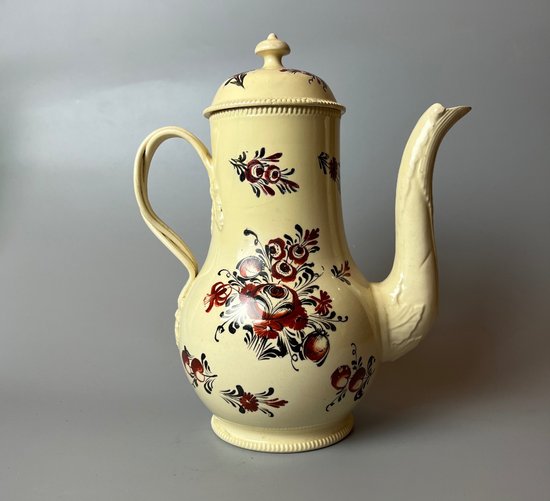 A late 18thc floral painted creamware coffee pot. Perhaps Yorkshire. c.1770