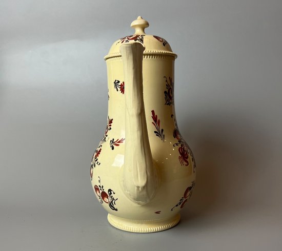 A late 18thc floral painted creamware coffee pot. Perhaps Yorkshire. c.1770