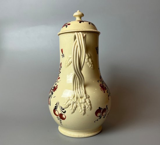 A late 18thc floral painted creamware coffee pot. Perhaps Yorkshire. c.1770