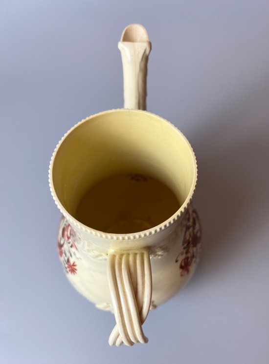A late 18thc floral painted creamware coffee pot. Perhaps Yorkshire. c.1770