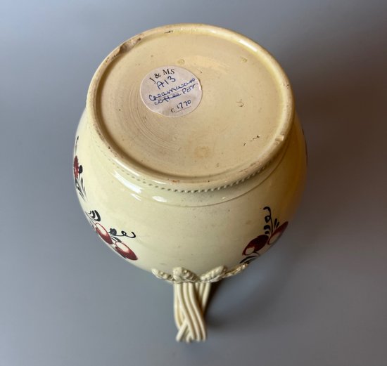 A late 18thc floral painted creamware coffee pot. Perhaps Yorkshire. c.1770