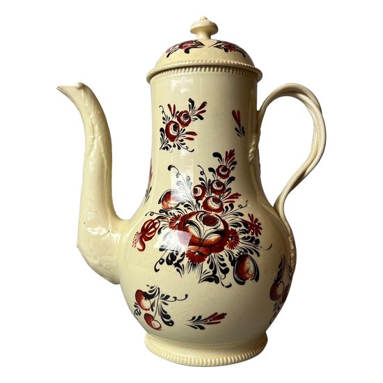 A late 18thc floral painted creamware coffee pot. Perhaps Yorkshire. c.1770