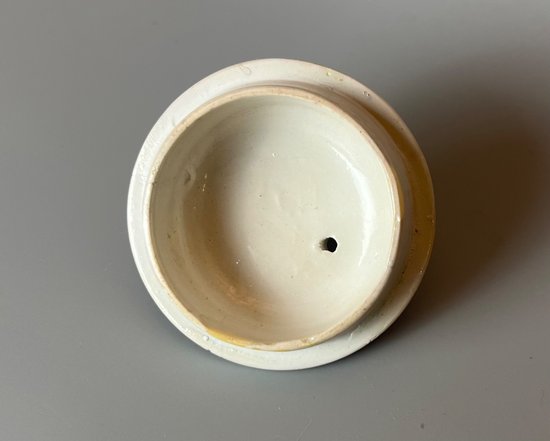 A rare & charming Bow miniature teapot, c1760, bullet form, polychrome decorated