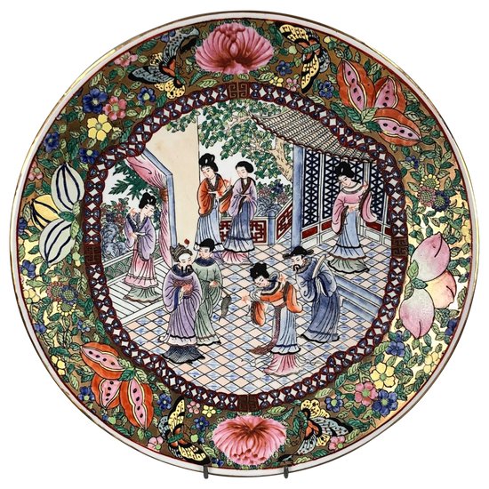 A fine Qing 19thc. Canton Famille Rose charger, painted with a courtly scene.