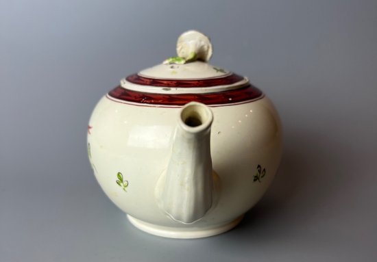 A Leeds Creamware Ovoid Teapot and Cover, c.1775,  with entwined handles.