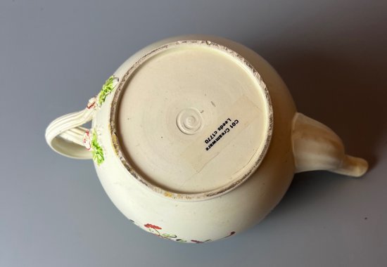 A Leeds Creamware Ovoid Teapot and Cover, c.1775,  with entwined handles.