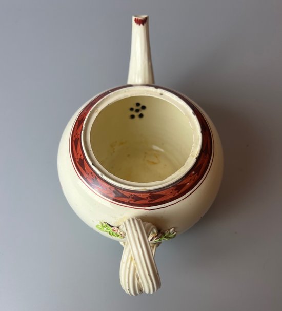A Leeds Creamware Ovoid Teapot and Cover, c.1775,  with entwined handles.