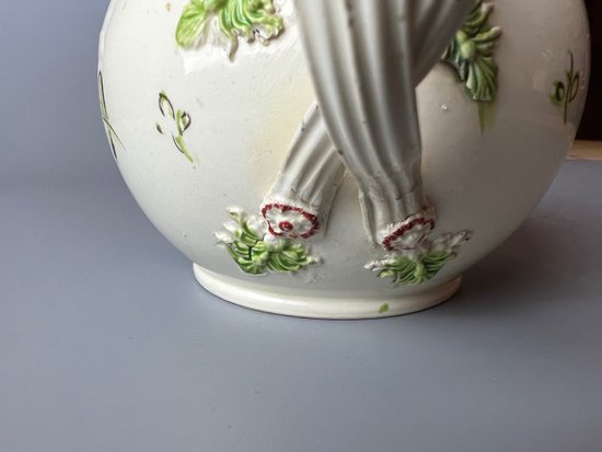 A Leeds Creamware Ovoid Teapot and Cover, c.1775,  with entwined handles.