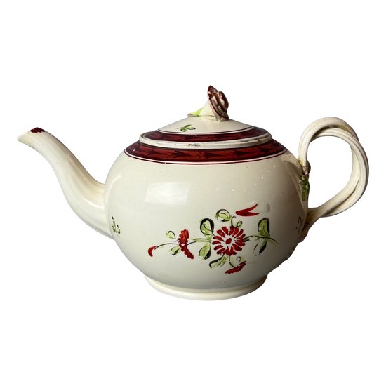 A Leeds Creamware Ovoid Teapot and Cover, c.1775,  with entwined handles.