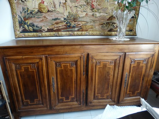 Walnut sideboard opening to 4 doors in front. Regional work Louis XVI. Late 18th and early 19th century.