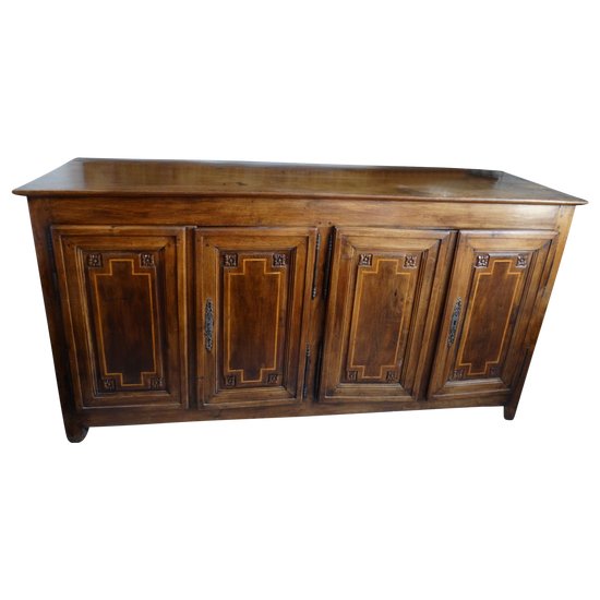 Walnut sideboard opening to 4 doors in front. Regional work Louis XVI. Late 18th and early 19th century.