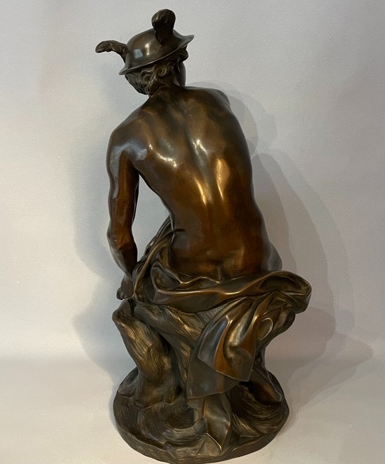 Sculpture en bronze"Mercure attachant ses talonnières". J-B Pigalle. (Hermès).