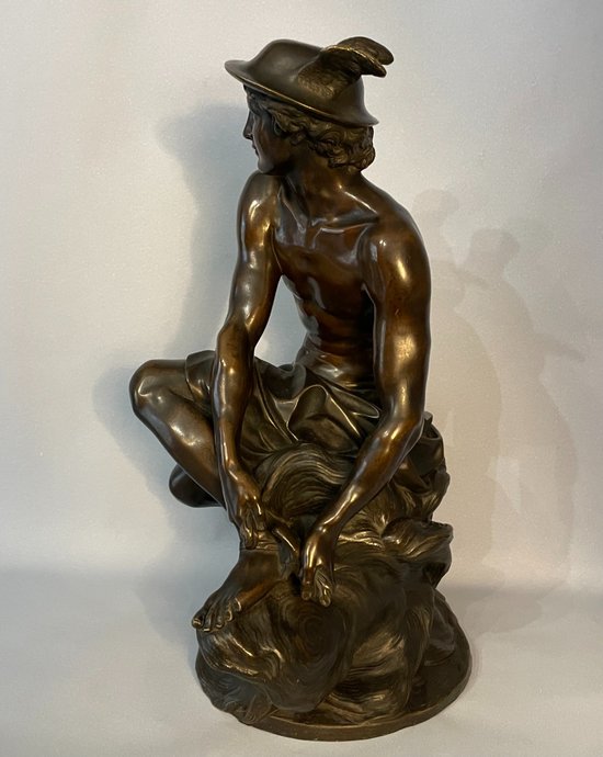 Sculpture en bronze"Mercure attachant ses talonnières". J-B Pigalle. (Hermès).