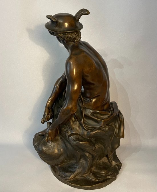 Sculpture en bronze"Mercure attachant ses talonnières". J-B Pigalle. (Hermès).