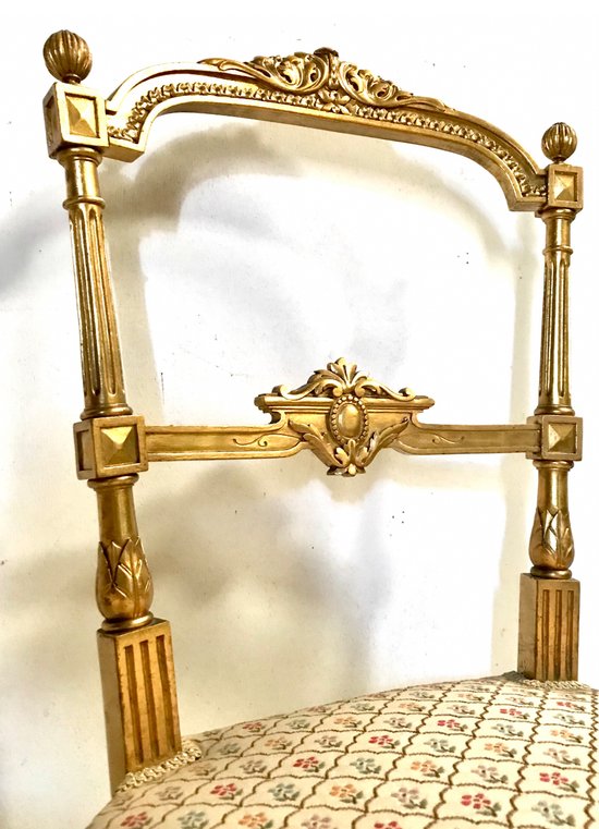 Pair of gilded wooden chairs
