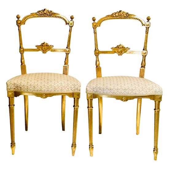 Pair of gilded wooden chairs