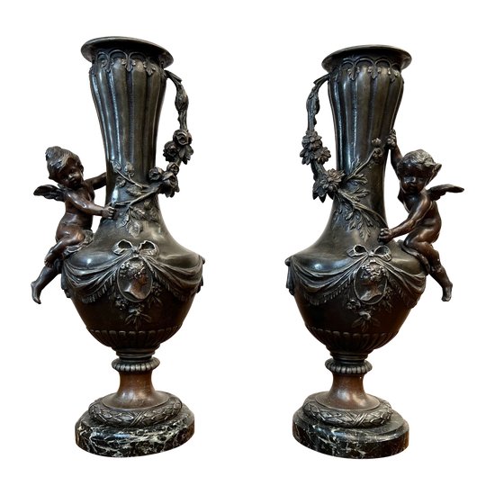 Pair of vases in regula with angel decoration
