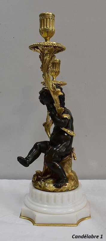 Coppia di candelabri in bronzo "Un Amour et un Faune", da Clodion e Delarue - Fine XIX secolo