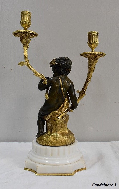 Coppia di candelabri in bronzo "Un Amour et un Faune", da Clodion e Delarue - Fine XIX secolo