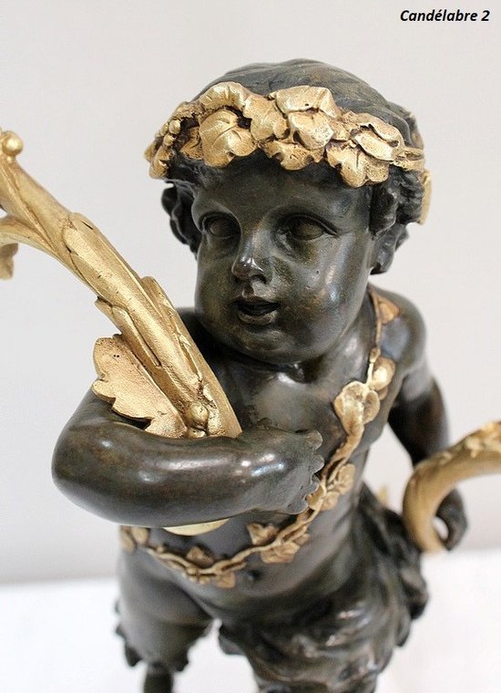 Coppia di candelabri in bronzo "Un Amour et un Faune", da Clodion e Delarue - Fine XIX secolo