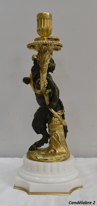 Coppia di candelabri in bronzo "Un Amour et un Faune", da Clodion e Delarue - Fine XIX secolo