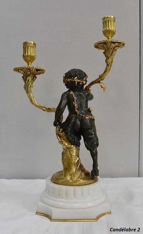 Coppia di candelabri in bronzo "Un Amour et un Faune", da Clodion e Delarue - Fine XIX secolo