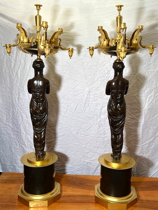 Pair of very important candelabra of Empire period in patina and gilt bronze