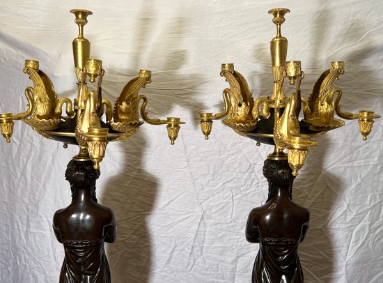 Pair of very important candelabra of Empire period in patina and gilt bronze