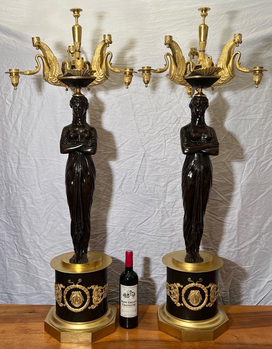 Pair of very important candelabra of Empire period in patina and gilt bronze