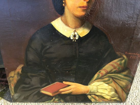 Porträt einer Frau mit einem Buch.1860