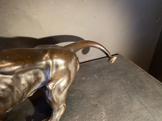 bronze walking lion