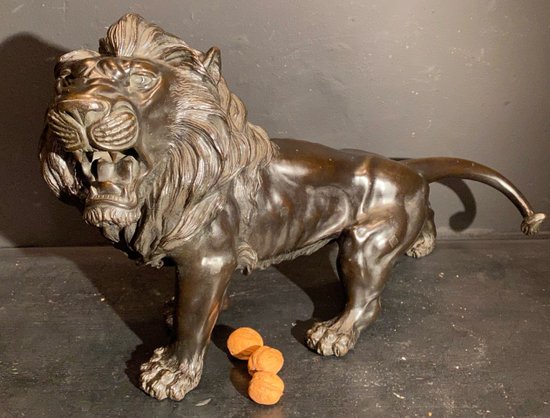 bronze walking lion