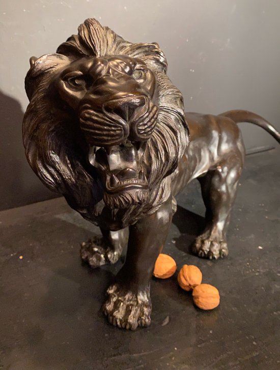 bronze walking lion