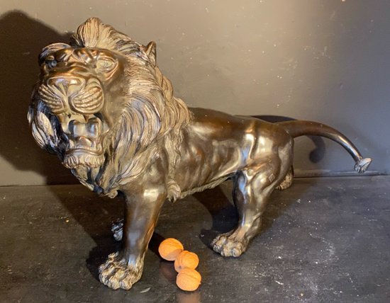 bronze walking lion