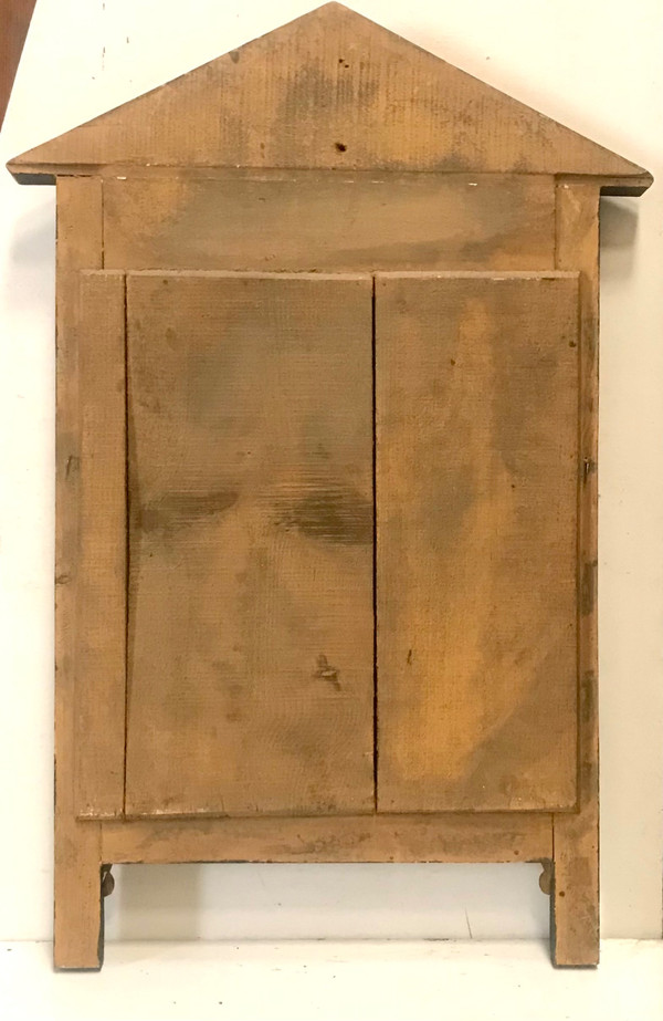 Miroir en bois doré et teinté de style Empire XIXème 