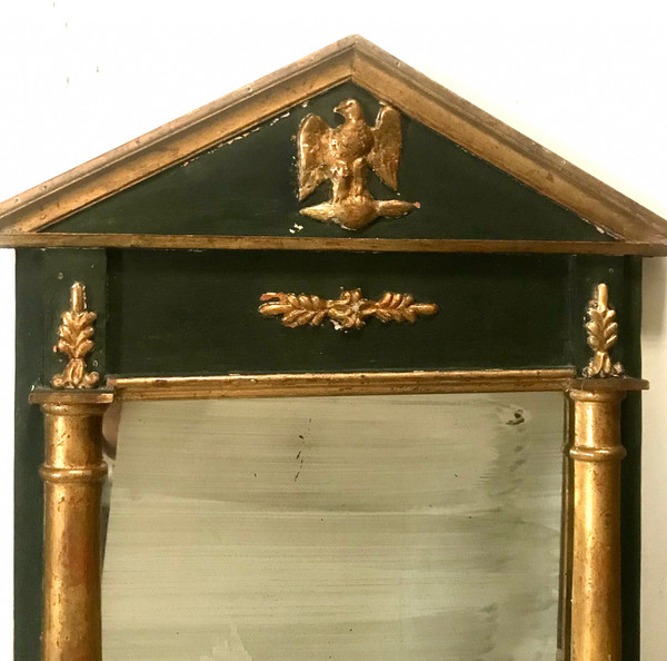 Miroir en bois doré et teinté de style Empire XIXème 