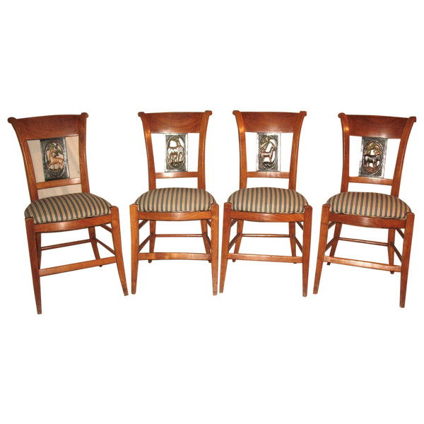 Suite of 4 chairs in cherry wood decorated with animals from the 4 continents