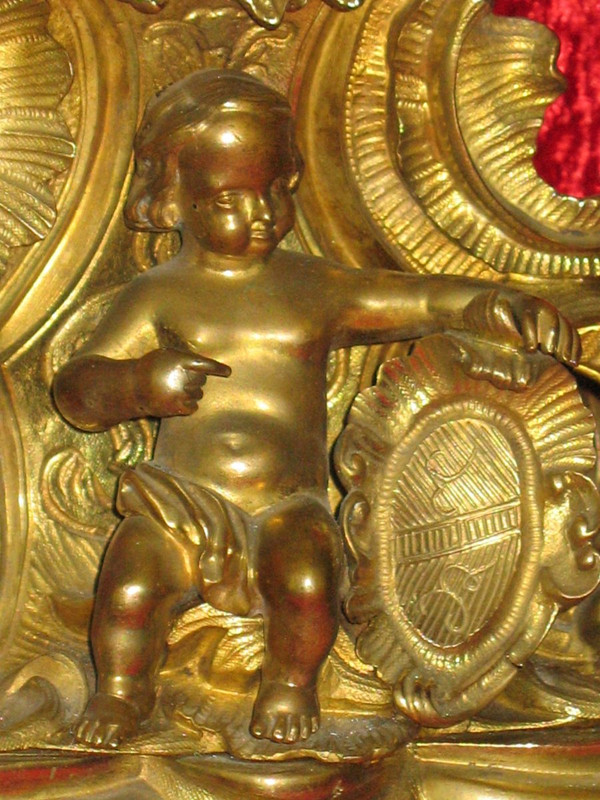 Cartel in bronze 19th century Rocaille style with cherub