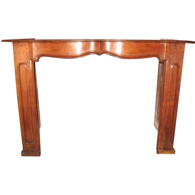 Walnut mantel with crossbow front and molded sides from the Regency period Origin Périgord 18th century