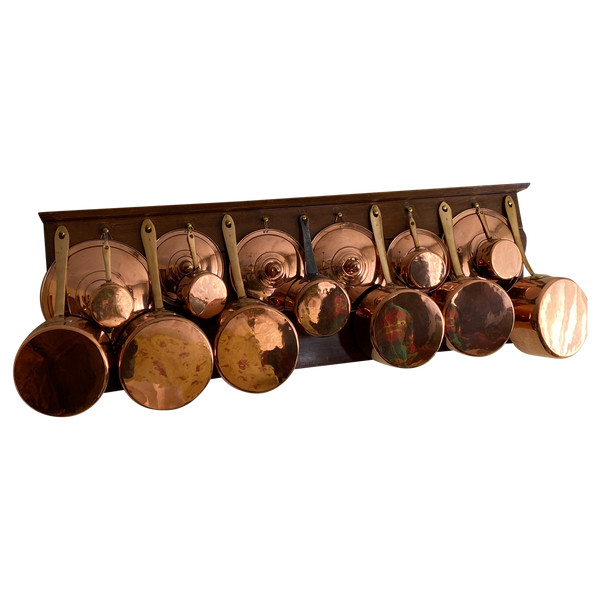 Series of copper saucepans and lids