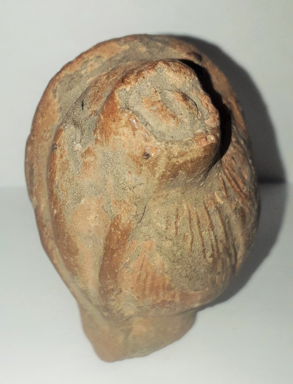 Antique head of a woman with a highlighted hairstyle raised in a high bun terracotta height 7.2 width 4 depth 5.5 cm