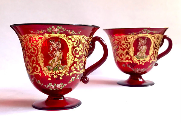 Pair of cups and saucers in ruby red enamelled Venetian glass