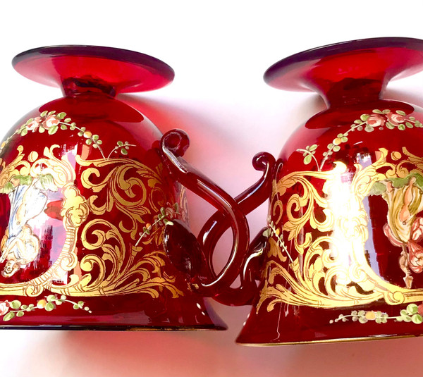 Pair of cups and saucers in ruby red enamelled Venetian glass