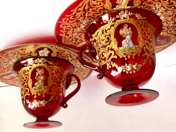 Pair of cups and saucers in ruby red enamelled Venetian glass