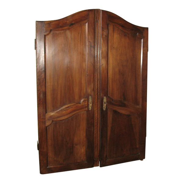 Pair of Louis XV style walnut paneled doors, 19th century