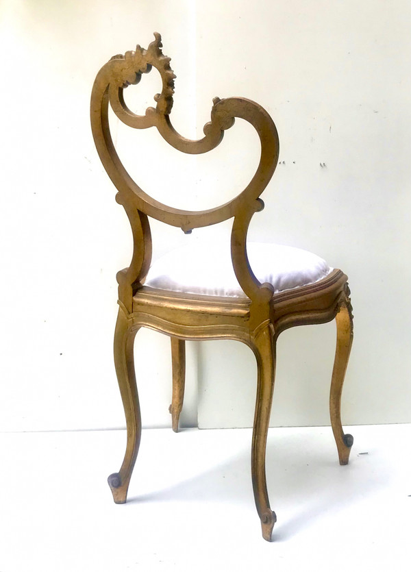 Louis XV Rocaille style chair in gilded wood