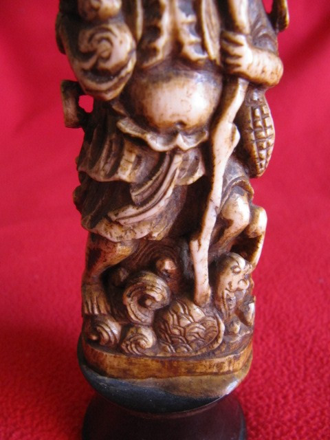 Chinese bone sculpture on blackened wooden base late 19th