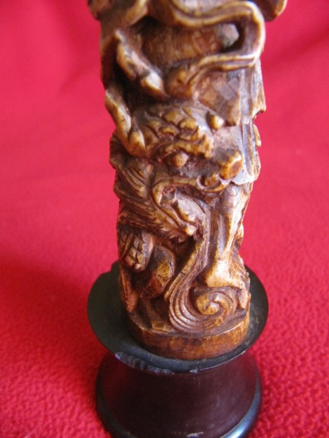 Chinese bone sculpture on blackened wooden base late 19th